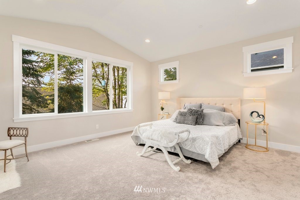 900 232nd Street Southeast, Unit 3 Bothell, WA 98021 - Photo 14 of 25 a bedroom with a bed and a large window