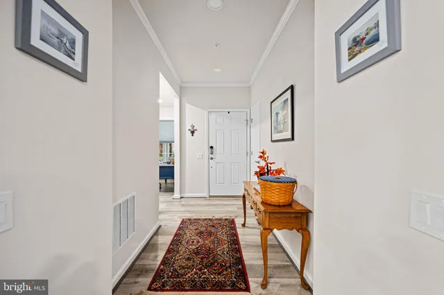 a kitchen with stainless steel appliances a sink a window and cabinets