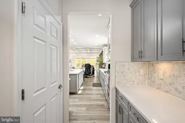 a view of balcony with wooden floor and seating space