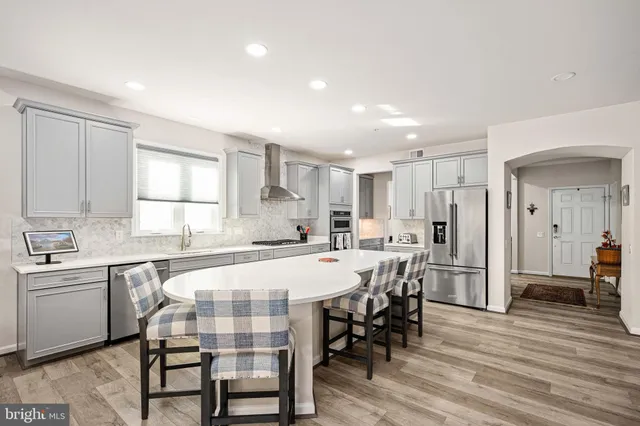 a living room with furniture and flowers