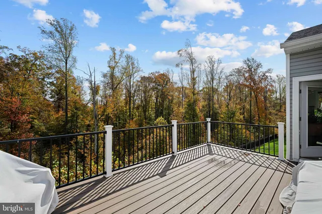 a view of a hallway with wooden floor and a hallway