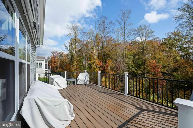 a bathroom with a sink a toilet a mirror and shower