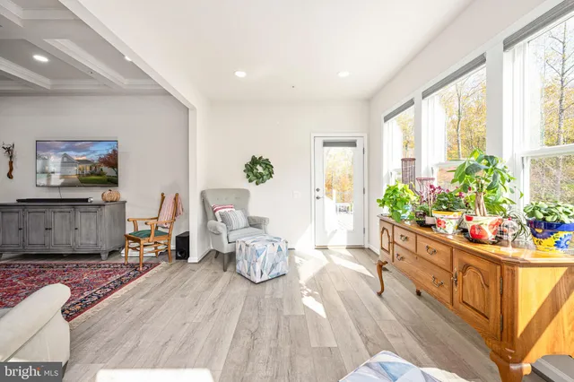 a bedroom with a bed and a chair