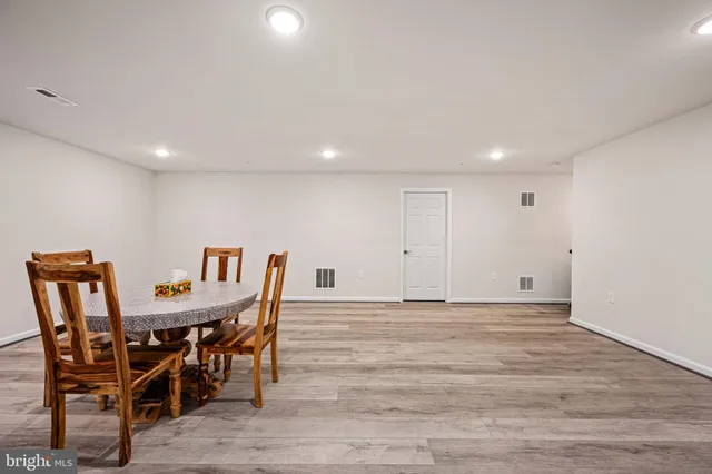 a view of a swimming pool with outdoor seating and a patio