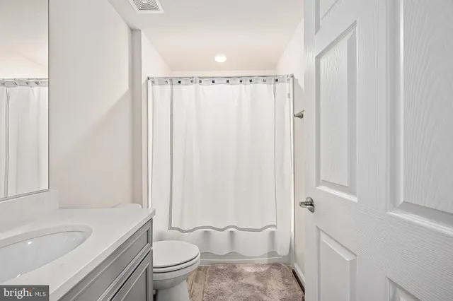 a view of a backyard with large trees