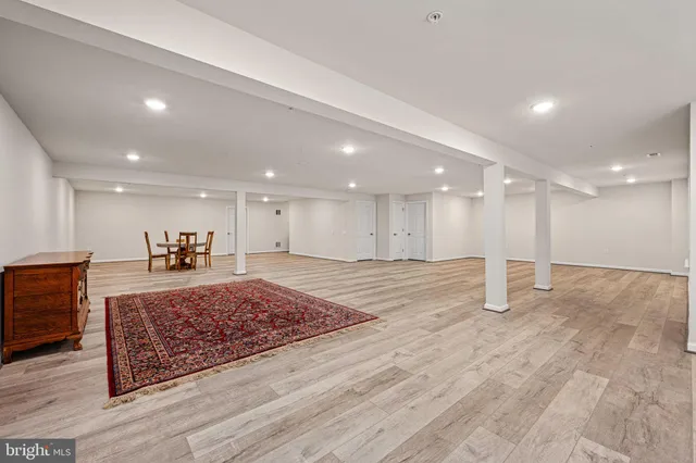 a view of a house with a big yard and potted plants