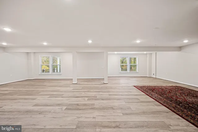 a building outdoor space with patio furniture and potted plants