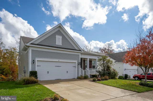 a front view of house with garden
