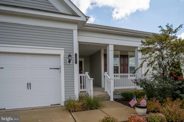 a hallway with a dining table and workspace