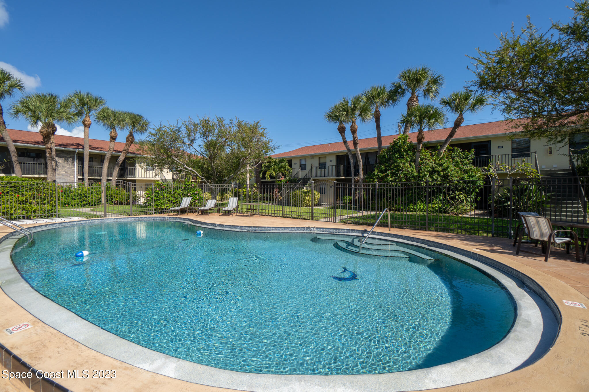 500 Catalina Road, Unit 103 Cocoa Beach, FL 32931 - Photo 23 of 28 a view of outdoor space yard swimming pool and patio