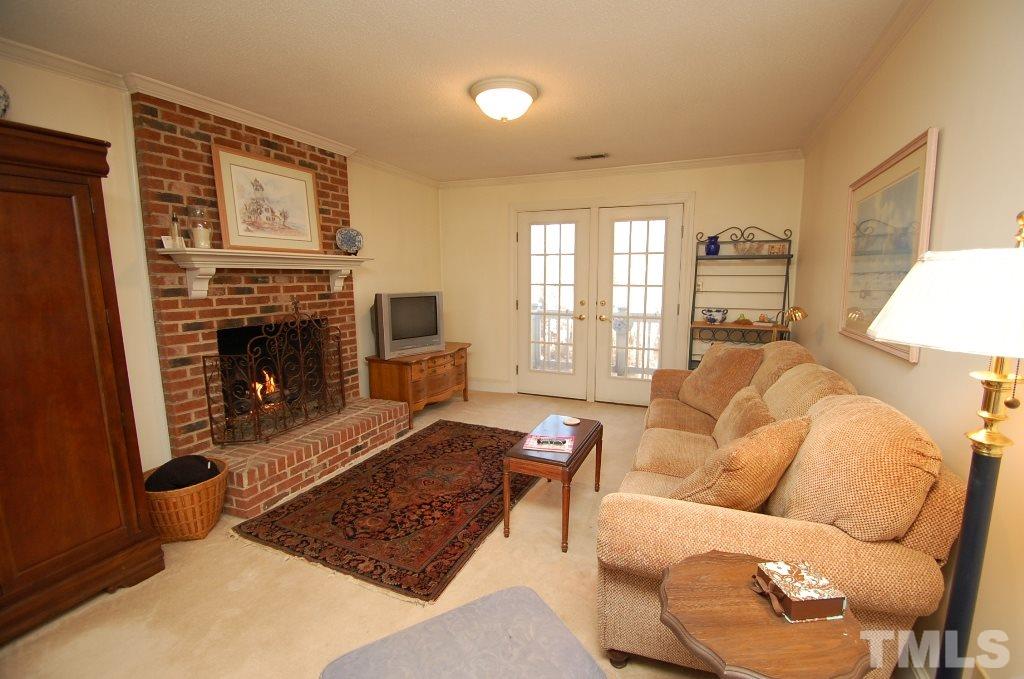 8840 Stage Ford Road Raleigh, NC 27615 - Photo 14 of 25 a living room with furniture rug and window