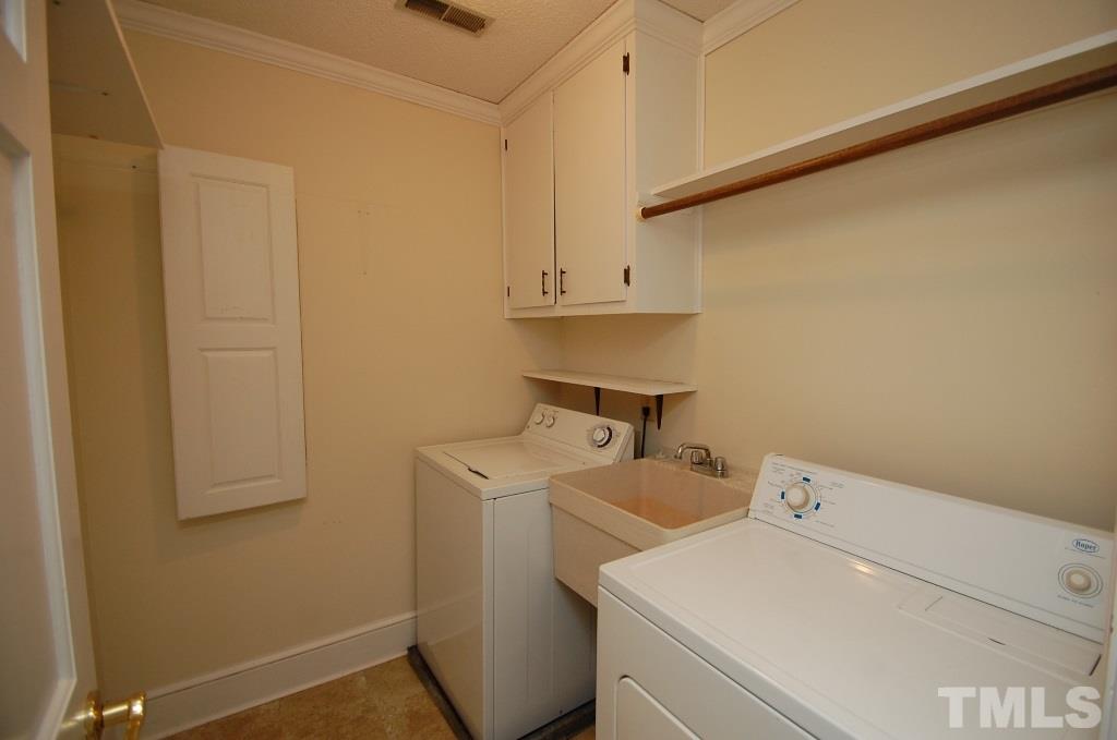 8840 Stage Ford Road Raleigh, NC 27615 - Photo 22 of 25 a utility room with dryer and washer