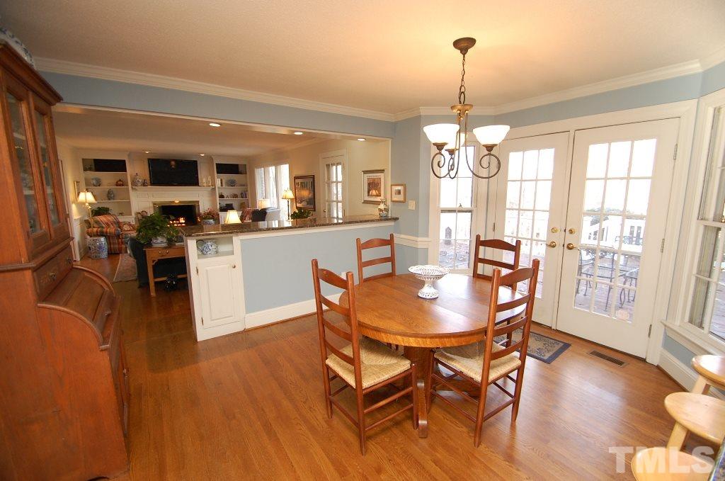 8840 Stage Ford Road Raleigh, NC 27615 - Photo 8 of 25 a dining room with furniture window wooden floor