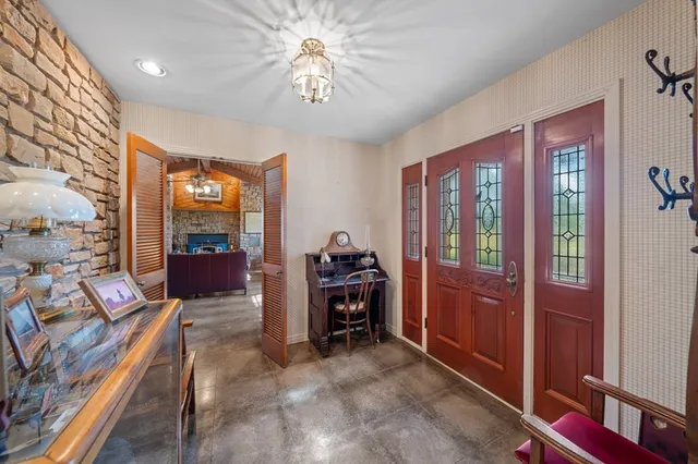 a view of a livingroom with furniture and windows