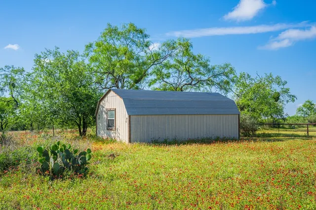 a view of swimming pool with an outdoor space and seating area