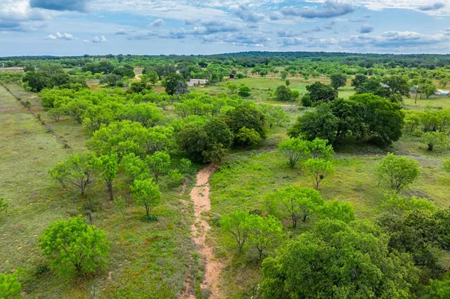 a view of a lake with a yard