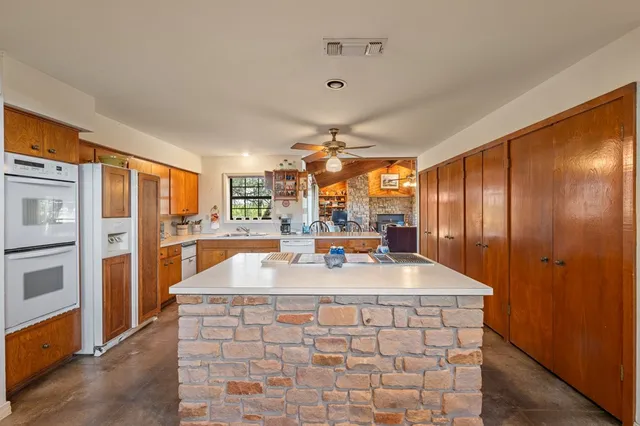 a room with pool table and a large window