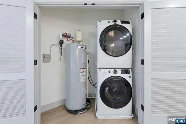 a close view of a utility room with dryer and washer