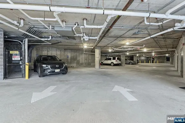 a view of parking garage with cars