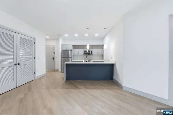 a view of kitchen with wooden floor