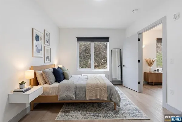 a bedroom with a large bed and a couch