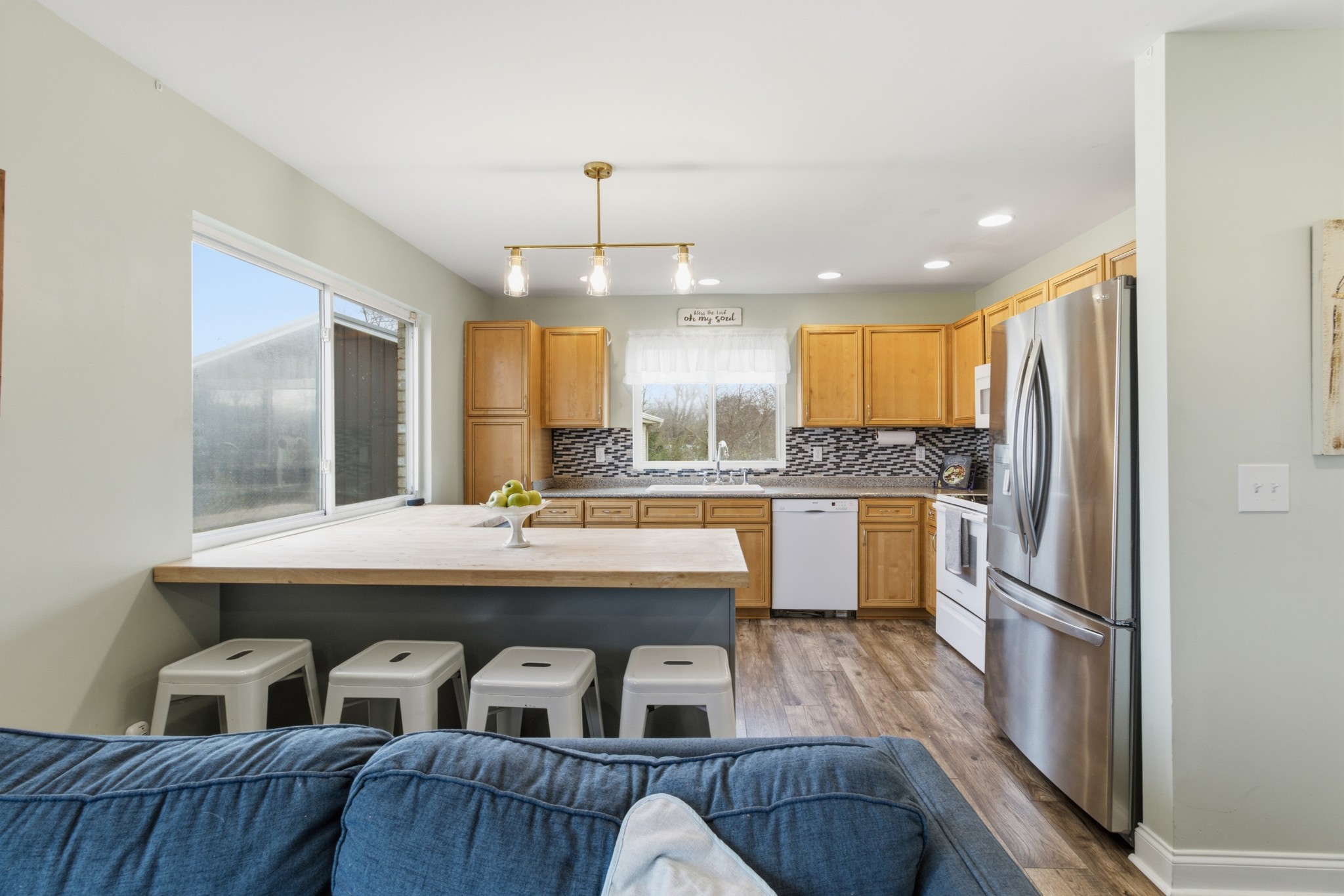 558 Ferrells Loop Road Beechgrove, TN 37018 - Photo 14 of 46 a kitchen with kitchen island granite countertop a sink a counter top stainless steel appliances and cabinets