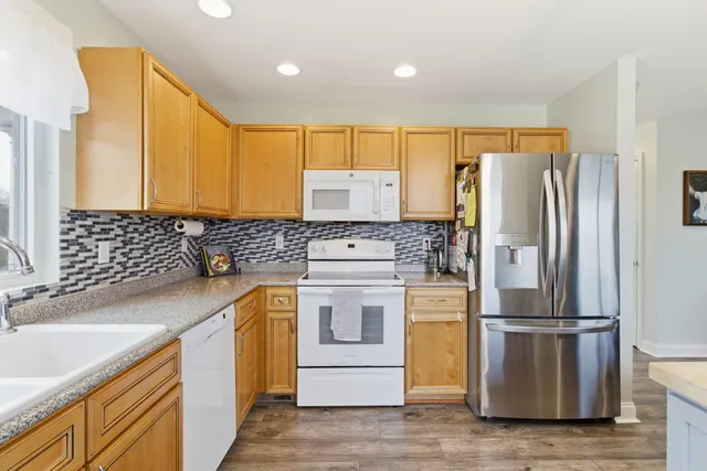 a bedroom with a bed and a night stand