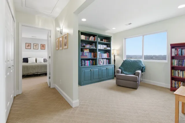 a en suite bathroom with a toilet a sink and mirror