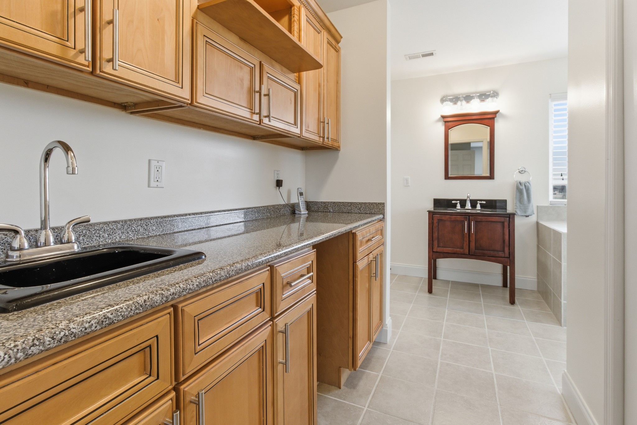 558 Ferrells Loop Road Beechgrove, TN 37018 - Photo 28 of 46 a kitchen with granite countertop a sink and cabinets