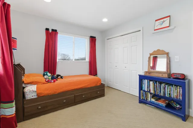 an aerial view of a house with a swimming pool
