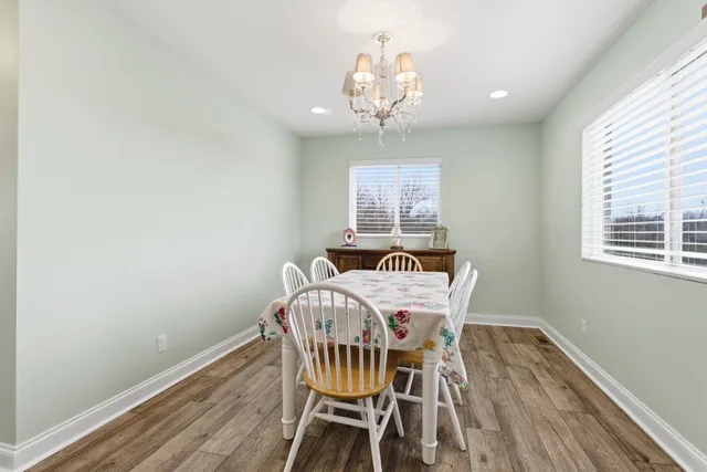 a livingroom with workspace and a couch