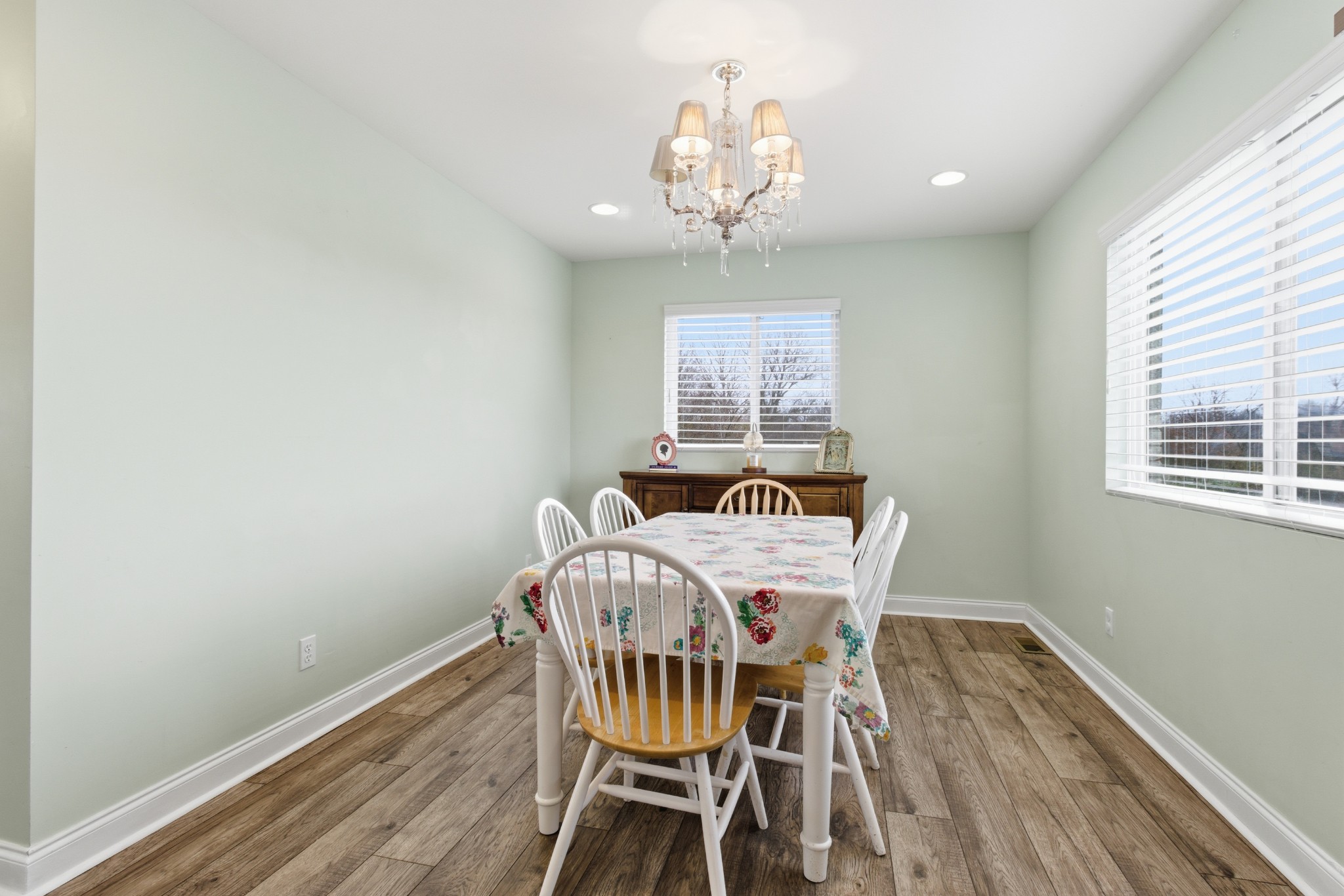 558 Ferrells Loop Road Beechgrove, TN 37018 - Photo 8 of 46 a view of a dining room with furniture a chandelier and wooden floor