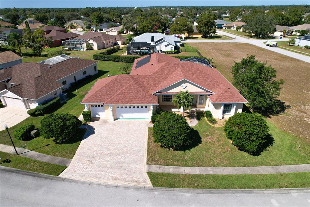 3441 Cedar Crest Loop Spring Hill, FL 34609 - Photo 1 of 58 an aerial view of residential houses with outdoor space and street view