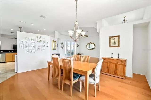 a kitchen with granite countertop a sink a counter top space appliances and cabinets