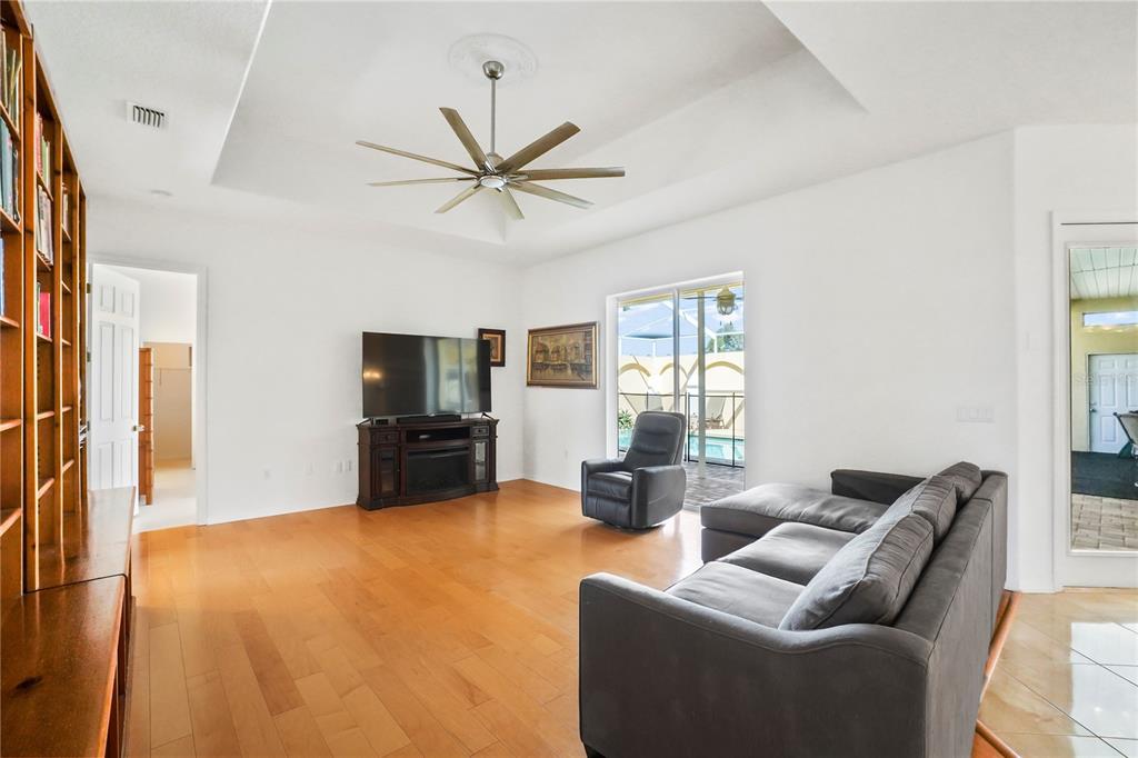 3441 Cedar Crest Loop Spring Hill, FL 34609 - Photo 25 of 58 a living room with furniture and a flat screen tv