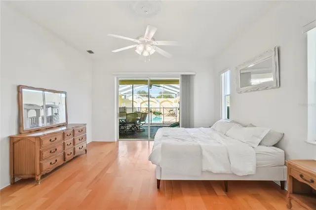 a spacious bathroom with a tub sink and mirror