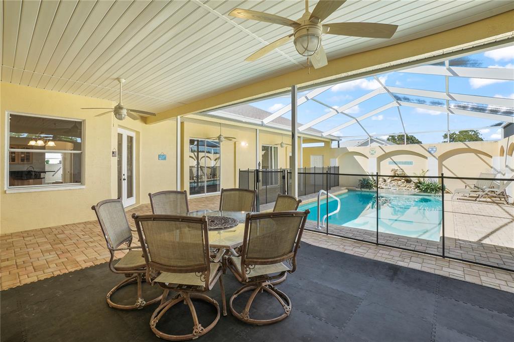 3441 Cedar Crest Loop Spring Hill, FL 34609 - Photo 33 of 58 a dining room with furniture and floor to ceiling window