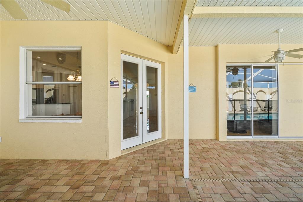 3441 Cedar Crest Loop Spring Hill, FL 34609 - Photo 37 of 58 a view of a hallway with wooden floor and a living room