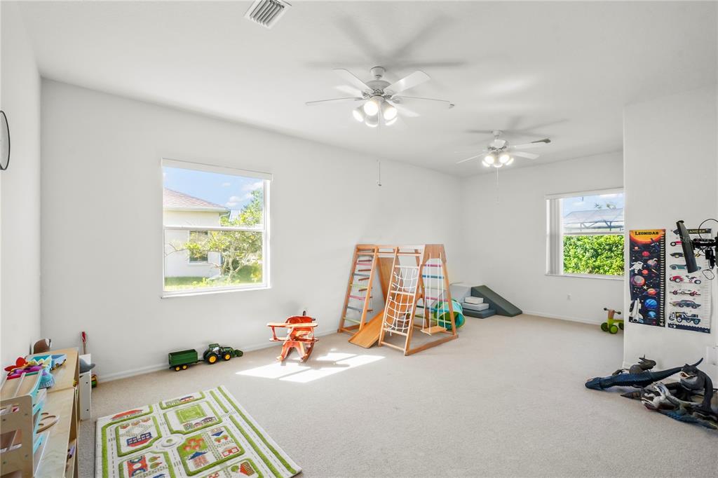 3441 Cedar Crest Loop Spring Hill, FL 34609 - Photo 38 of 58 a view of a room with gym equipment
