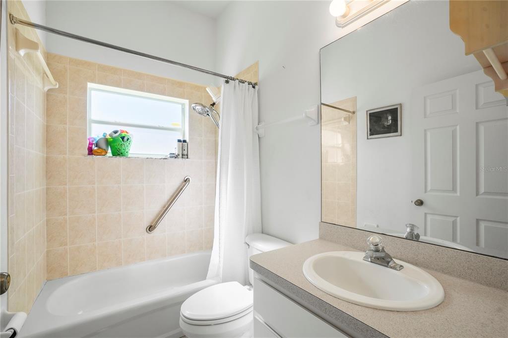 3441 Cedar Crest Loop Spring Hill, FL 34609 - Photo 41 of 58 a bathroom with a sink toilet and shower