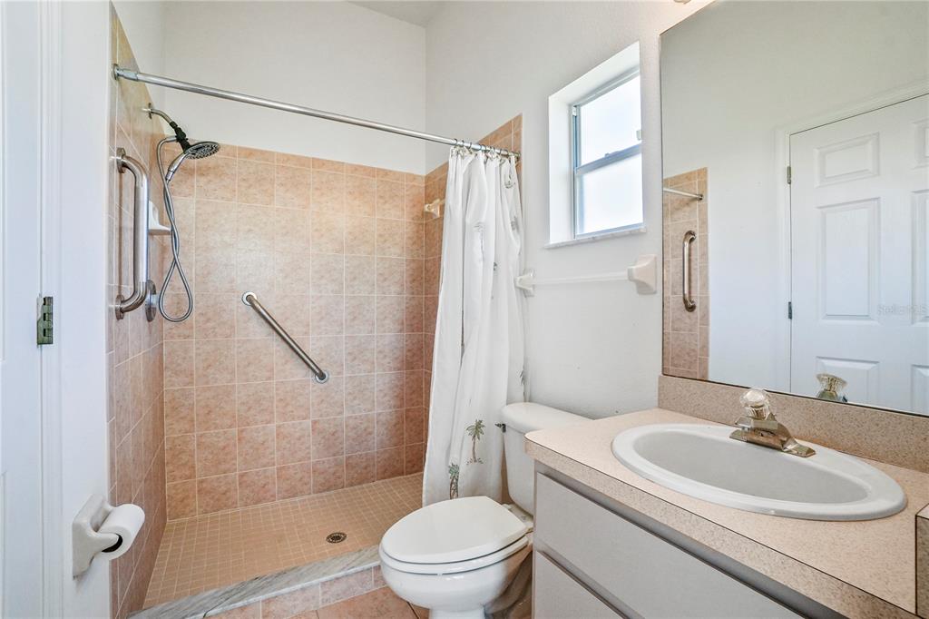 3441 Cedar Crest Loop Spring Hill, FL 34609 - Photo 48 of 58 a bathroom with a sink toilet tub and shower