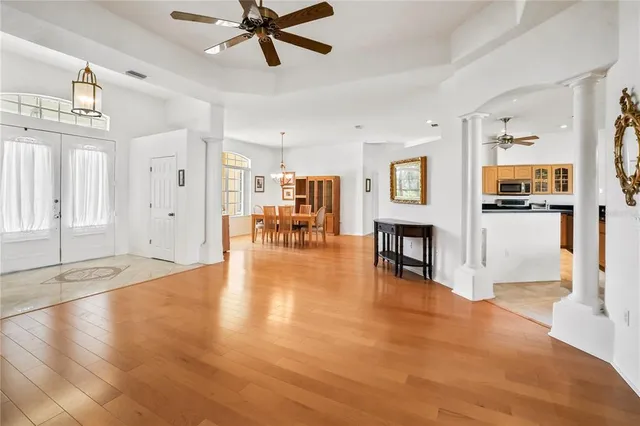 a view of a livingroom with furniture wooden floor and a window