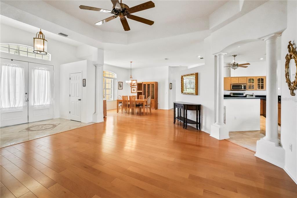 3441 Cedar Crest Loop Spring Hill, FL 34609 - Photo 8 of 58 a view of a livingroom with furniture wooden floor and a window