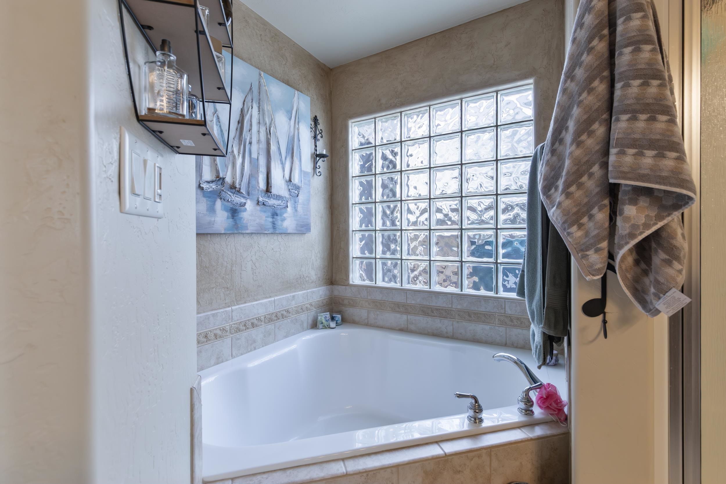 544 Hemlock Drive Fruita, CO 81521 - Photo 22 of 36 a bath tub sitting next to a window