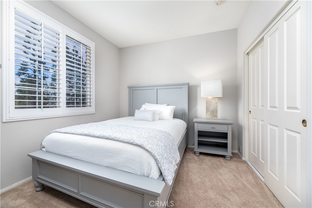 24 Silveroak Irvine, CA 92620 - Photo 17 of 23 a bedroom with a bed and a window