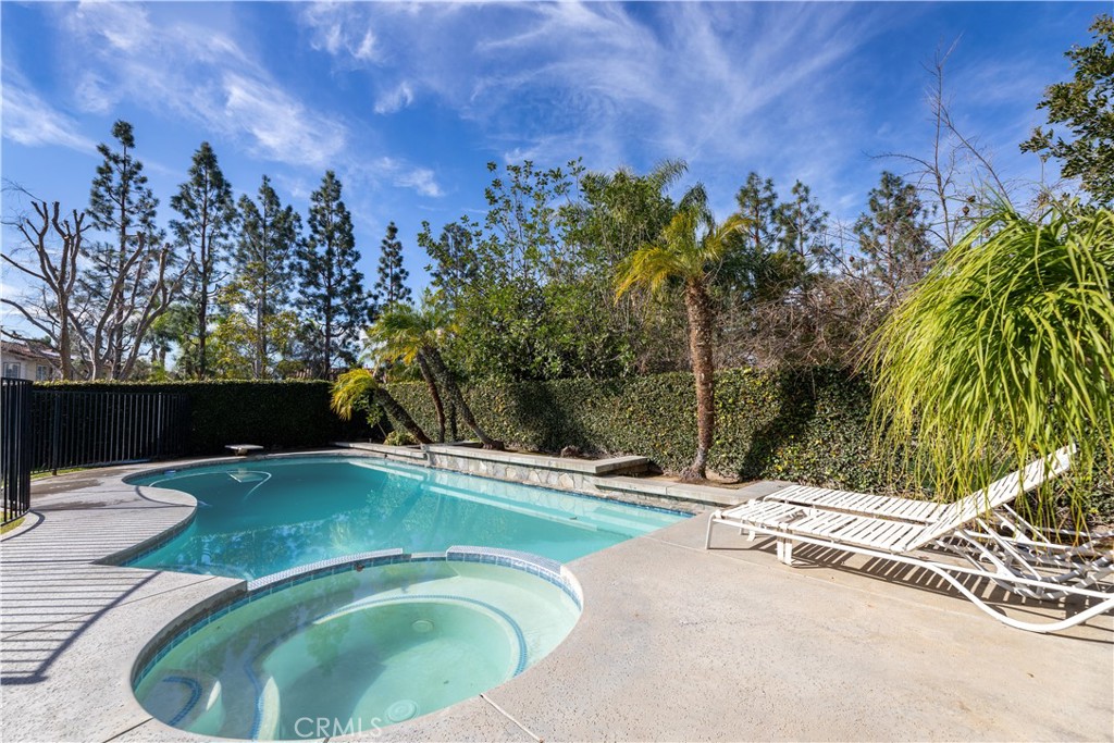 24 Silveroak Irvine, CA 92620 - Photo 21 of 23 a view of a swimming pool with a yard