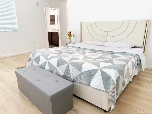 a large white bed in a white room