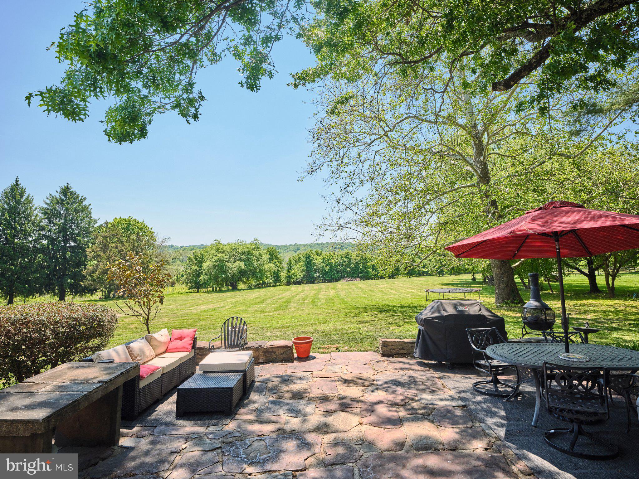 765 Swamp Road Newtown, PA 18940 - Photo 29 of 37 a view of backyard with outdoor seating ad green space