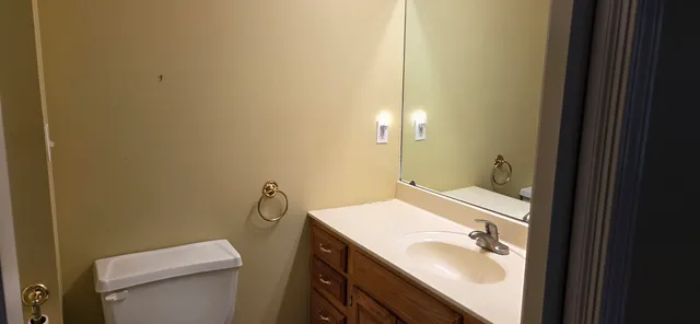 a bathroom with a white toilet