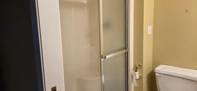 a kitchen with windows and cabinets